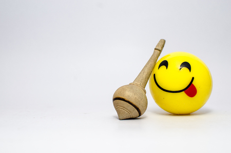 Smiley with a war weapon smiling and showing tongue doing naughty gestureの写真素材