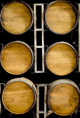 Wooden Barrels of wine or whisky giving a beautiful backgroundの写真素材