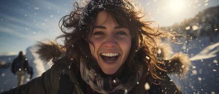 Photo of a joyful young woman on a winter adventure, her smile radiating happiness against a snowy backdrop. Dressed in fashionable winter clothing, she embodies the spirit of the season while walking through a frost-covered park.の素材