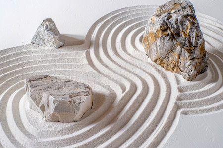 A rock garden with a white path and three rocks.の素材