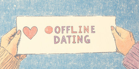 Offline Dating Concept Human Connection in a Digital Age Hand Holding Sign with Love Symbol.の素材