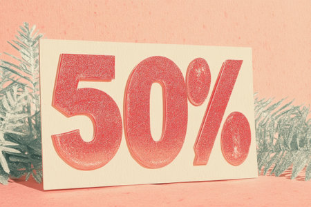 Festive 50% Discount Sign with Holiday Theme on Coral Background.の素材
