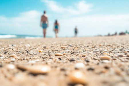 Serene Beach Walk with Seashells and Sand under a Blue Sky.の素材