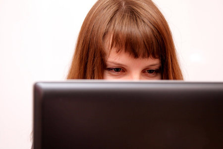 pretty lady is flirting on the computerの写真素材