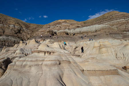 Drumheller Hoodoos, Alberta Canada - September 23, 2021: Tourists walking on the Hoodoos on a sunny day in Septemberのeditorial素材