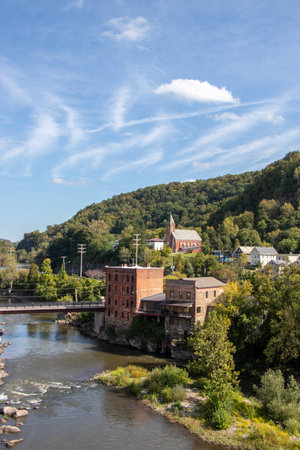 scenic townscape of historic buildings beside a riverの写真素材