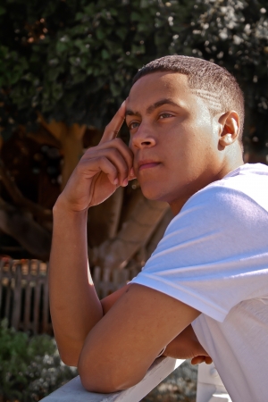 A young man has a pensive expression.の写真素材