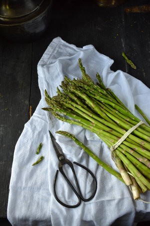 Fresh Asparagus string bundled in rustic settingの写真素材