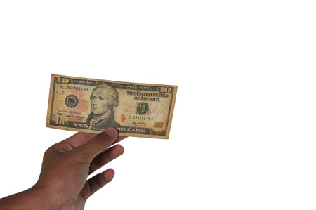 Hand holds dollar banknotes.