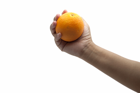 Woman's hand holding orange on white backgroundの写真素材