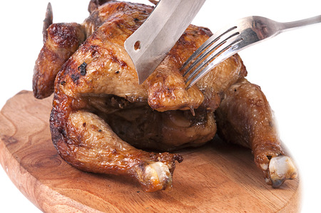 Grilled chicken on wooden cutting boardの写真素材