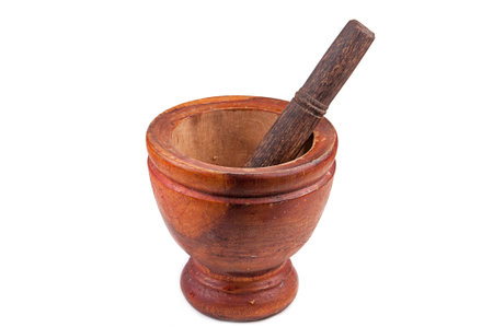 Wood mortar and pestle on white backgroundの写真素材