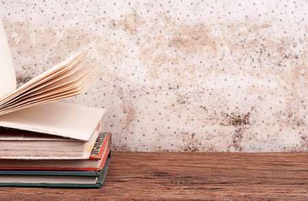 Open book, hardback books on wooden table. Back to school. Copy spaceの写真素材
