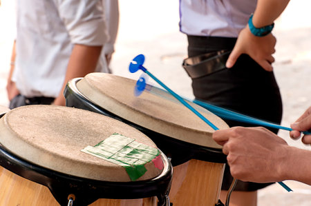 Percussionist slap hand on the Conga in school.の写真素材