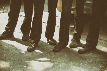 Group of people standing outdoors, close up on low section body .の写真素材