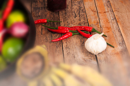 fresh chili pepper on wood floorの写真素材