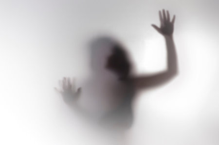 Woman standing behind frosted glass. Image creates feeling of depression, Man behind a screen,...