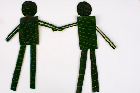 Two man Handshake made of leaves.の写真素材