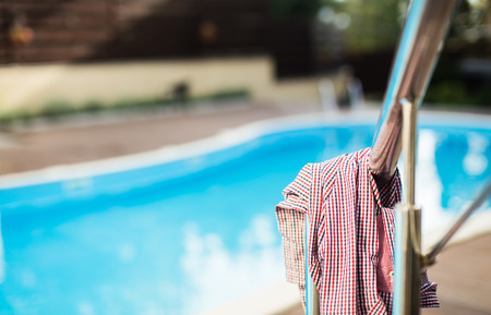 Shirt left on a railing near the swimming poolの写真素材