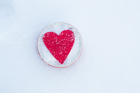 Heart in a bowl in snow, Valentine's Day.  Copy space for textの写真素材