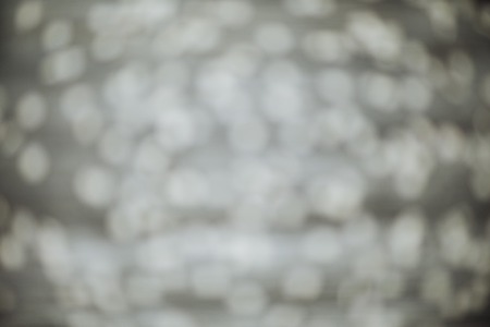 Blurred gray background with white spots. Copy spaceの写真素材