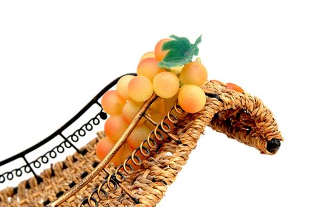 Bunch of grapes isolated on white background. Bunch is in the basket.の写真素材