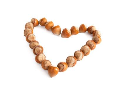 Nuts like as heart isolated on a white .の写真素材