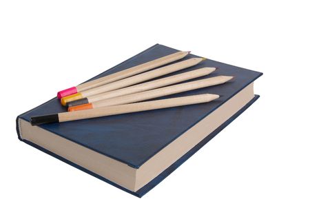 Book and five pencils isolated on a white background.の写真素材