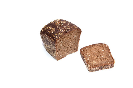 Rye bread full of seeds isolated on a white background.