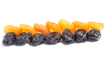 Dried apricot and prune  isolated on a white background.の写真素材