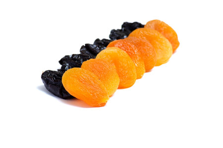 Dried apricot and prune  isolated on a white background.の写真素材