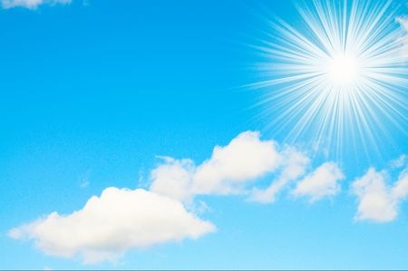 Fun sun and white clouds on a blue sky.の写真素材