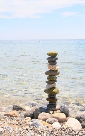 Pebble stack on the seashore by summer.の写真素材