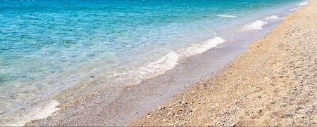 Colorful view of seaside with waves by summer.の写真素材
