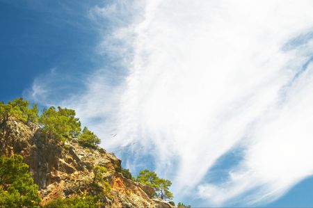 Magic mountains and sea gulls flying in the blue sky.の写真素材
