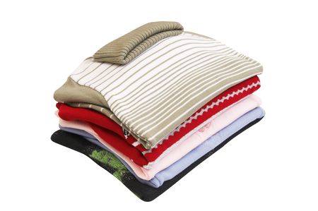 Pile of warm,stylish sweaters isolated on a white background.の写真素材