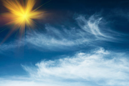 Beautiful blue sky with clouds and sun.