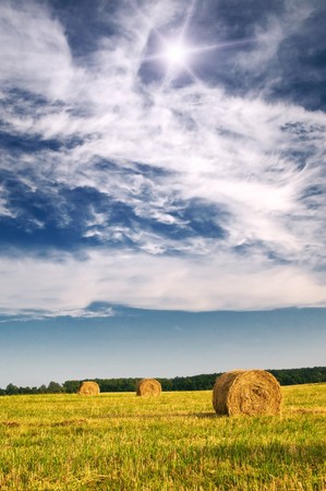 Three haystack and wonderful clouds.の写真素材
