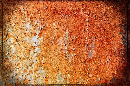 Oxidized metal sheet covered with old paint の写真素材