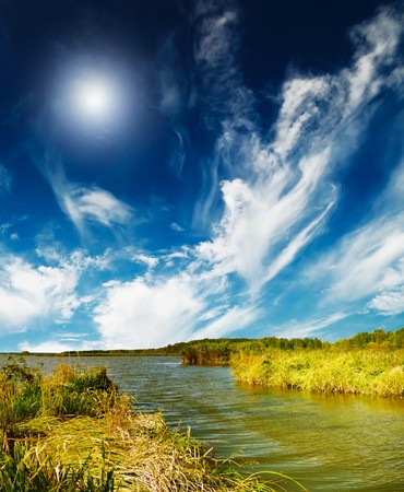 Wonderful lush bulrush  and nice lake by autumn.の写真素材