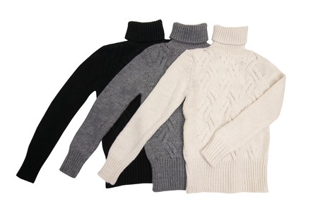 Three trendy sweaters isolated on a white background.の写真素材