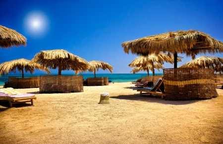 Wooden sunbeds  on the beach の写真素材