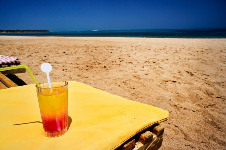 Amazing beach and fresh juice against blue sky の写真素材
