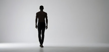 Silhouette of a man walking, full body illustrationの素材
