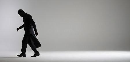 Silhouette of a man walking, full body illustrationの素材