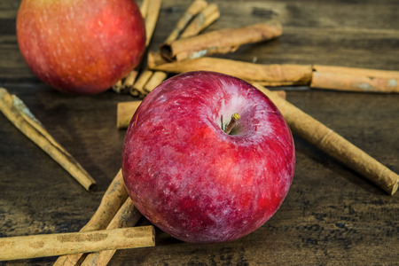 Apple and cinnamon on Wooden tableの写真素材