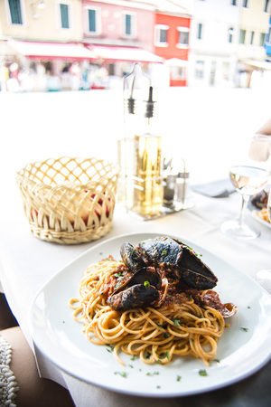 Eating spaguettis in Burano, a small island off of Venice.の写真素材