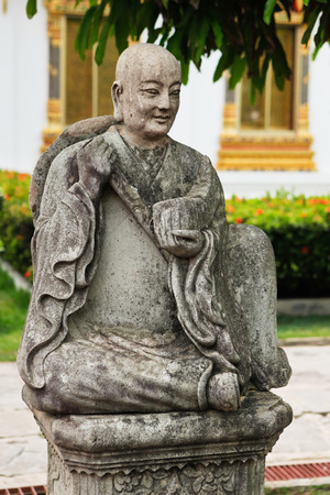 sculpture of thai monk in the temple in Bangkok, Thailandの写真素材