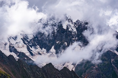 Bad weather in the mountains. Picture was taken during a trekking in the amazing and stunning Caucasus mountains, Bezengi region, Kabardino-Balkaria, Russiaの写真素材