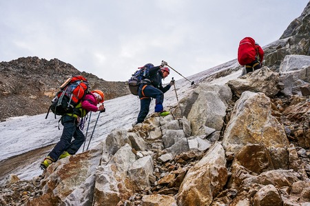 CAUCASUS, KABARDINO-BALKARIA, RUSSIA - JULY 25, 2014:  Group of climbers ascent to the mountain during a sporting hikeのeditorial素材
